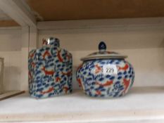 2 Chinese/Japanese pottery items featuring koi designs