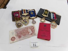 A quantity of 1960's RAOB medals including 3 silver with members book together with a 10/- note