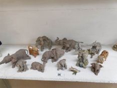 12 Tusker elephant figures and 2 Highland cattle figures