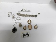 A mixed lot including silver coin bracelet,