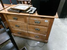 A stained pine chest of 4 drawers