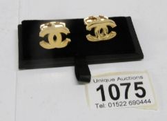 A pair of Chanel cuff links