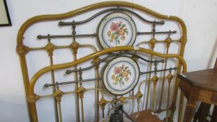 A brass and iron bedstead complete with side rails