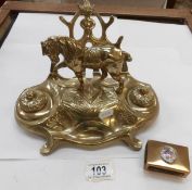 A brass twin well inkstand and a brass match box holder