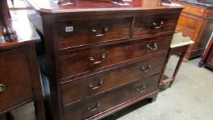 A mahogany 2 over 3 chest of drawers with brass drop handles