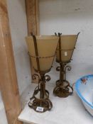 A pair of wrought iron lantern style table lamps