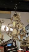A wrought iron 3 lamp ceiling light