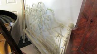 An iron bedstead complete with side rails
