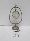 A silver pocket watch with key (in good working order) together with a continental 0.