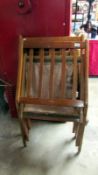 A pair of folding chairs with makers name of Centa,