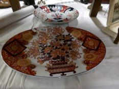 A 19th century Imari charger and a hand painted oriental meat platter