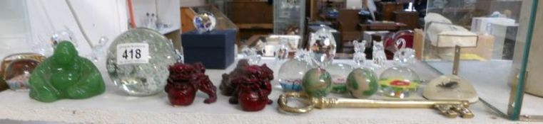 A quantity of paperweights,