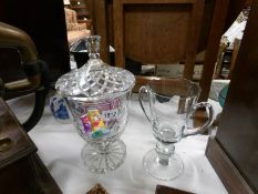 A large cut glass sweet/biscuit jar with dedication (31cm high) and a large glass loving cup (25cm