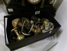A box of old brass and glass door handles