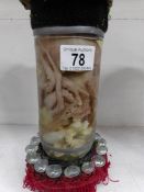A preserved octopus in a jar