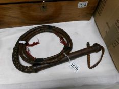 A long riding whip