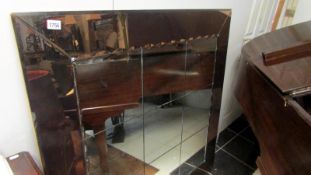 A large art deco style wall mirror