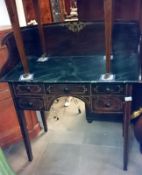 An old wash stand on tapered legs