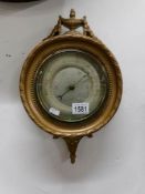 An ornate Regency style barometer