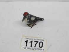 A German cold painted bronze woodpecker