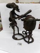 An unusual bronze of an African witch doctor