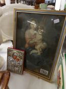 A small icon and a framed and glazed picture of Madonna and child