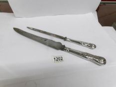 A silver handled King's pattern carving knife and skewer