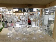 A cut glass decanter and 11 glasses