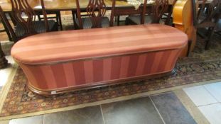 A large sarcophagus shaped blanket chest