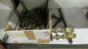 A quantity of brass curtain rings,