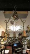 A wrought iron 4 lamp ceiling light