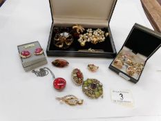 A mixed lot of brooches and earrings etc