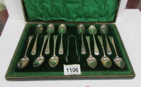 A cased set of 12 silver tea spoons with sugar nips,