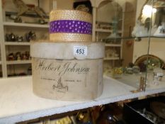 A Herbert Johnson straw boater with hat box