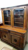 A 19th century bookcase with glazed top on cupboard base