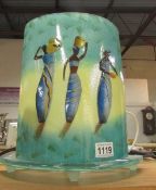 A retro style glass table lamp depicting figures of African women