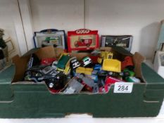 A box of mixed die cast including some boxed