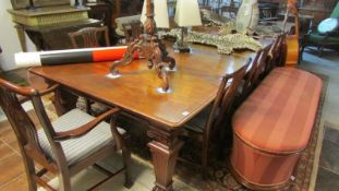 A large banqueting table measuring 14ft x 4ft 6 inches together with 10 chairs and 2 carvers