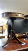 A small mahogany drum table