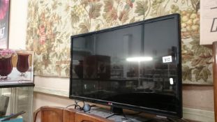 An LG flat screen television, digibox,