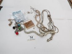 A quantity of white metal necklaces etc