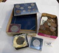 A mixed lot of UK coins including 2 sets and 2 £1 notes