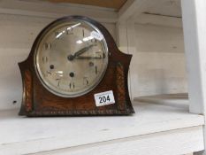 An Edwardian oak Westminster chime mantel clock