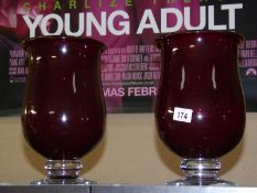 A pair of red glass 'Hurricane' vases