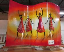 A retro style glass table lamp depicting African women figures