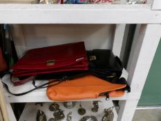 A leather briefcase and 3 other bags