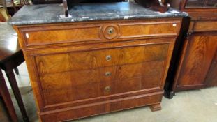 A 4 drawer figured mahogany chest with marble top