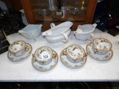 4 Limoges lidded tea cups and saucers together with 3 French sauce boats