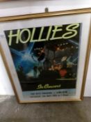 A framed and glazed Hollies poster