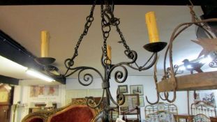 A wrought iron 3 lamp ceiling light